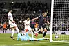 Manchester City's Erling Haaland, right, scores his side's first goal during the match against Tottenham Hotspur at Tottenham Hotspur Stadium in London, England on Tuesday. [AP/YONHAP]
