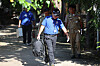 Cambodian police officials leave a temple in Phnom Penh on Oct. 20, after the autopsy of a Korean student allegedly tortured to death in the country took place. [YONHAP]