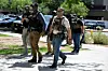 Masked law enforcement officers, including HSI and ICE agents, walk into an immigration court in Phoenix, Arizona, on May 21, 2025. [REUTERS/YONHAP]
