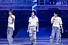 From left, Tomorrow X Together members Hueningkai, Beomgyu and Taehyun perform ″Quarter Life″ on Friday at KSPO Dome in Songpa District, southern Seoul. [BIGHIT MUSIC]