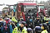 Police surround trucks with tractors loaded in the back in Seocho District, southern Seoul, on March 25. The trucks are driven by members of the Korean Peasants League protesting for the impeachment of President Yoon Suk Yeol. [NEWS1]