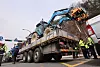 Police surrounds a truck with a tractor loaded in the back in Seocho District, southern Seoul, on March 25. [YONHAP]