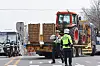 A truck turns around to head back to Gwacheon, Gyeonggi, after being blocked by police in southern Seoul on March 25. [YONHAP]