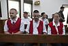 From left, British nationals Phineas Float, Jonathan Collyer and Lisa Stocker, who are accused of smuggling nearly a kilogram of cocaine into Indonesia, sit inside the courtroom before the start of their trial hearing at Denpasar District Court in Denpasar, Bali, on June 3. [AP/YONHAP]