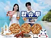 Models pose with the Domino Pizza's new summer menu, the Lobster Shrimp Toowoomba Pizza. [DOMINO PIZZA]