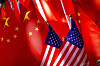 American flags are displayed together with Chinese flags on top of a trishaw on Sept. 16, 2018, in Beijing. [AP/YONHAP]