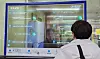 A person uses a real-time interactive translation service screen at Myeong-dong Station on subway line No. 4 in central Seoul. [SEOUL METRO]