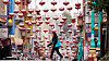 A person walks under lanterns hanging over Grant Avenue in Chinatown in San Francisco on April 18. [AP/YONHAP]