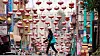 A person walks under lanterns hanging over Grant Avenue in Chinatown in San Francisco on April 18. [AP/YONHAP]