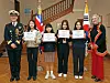 Andy Lamb, British defense attaché in Korea, far left, and his wife, far right, pose for a photo with the winners of the International Women's Day video competition after the award ceremony at the British Embassy in Seoul on Friday. [PARK SANG-MOON]