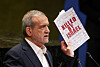 Iran's President Masoud Pezeshkian holds up a book as he addresses the 80th United Nations General Assembly (UNGA) at the U.N. headquarters in New York, U.S., Sept. 24, 2025. [REUTERS/YONHAP]