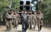 North Korean leader Kim Jong-un supervises a combined strike drill involving long-range artillery and missile systems on May 8. [YONHAP]