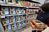 Grocery store staff points at displayed seaweed products in Seoul on Dec. 14, 2025. [YONHAP]