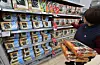 Grocery store staff points at displayed seaweed products in Seoul on Dec. 14, 2025. [YONHAP]