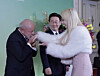 Brazilian President Luiz Inácio Lula da Silva, left, kisses Blackswan member Gabi, right, on the back of the hand during the Korea-Brazil state banquet at the State Guest House at the Blue House in central Seoul on Feb. 23. [SCREEN CAPTURE]