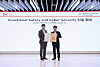 Park Ki-soo, head of R&D at SK On, right, poses for a photo with Noh Jin-pyo, head of Functional Safety & Cybersecurity in Asia Pacific at TUV Rheinland, following an international certification ceremony at SK On’s R&D Center in Daejeon on July 9. [SK ON]