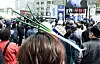 A supporter for the liberal Democratic Party (DP) wears a hairband with a green onion-shaped ornament at DP candidate Kwak Sang-eon's campaign rally in Jongno District, central Seoul, on Monday. [KIM SEONG-RYONG]