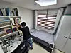 Cha Yoon-hee, a parent who brought her kids to Jangheung County, tidies up the interior of her home in the ″Study Village″ located in Im-ri, Jangpyeong-myeon, South Jeolla, on Apr. 3. [HWANG HEE-GYU]
