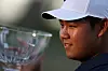 Tom Kim poses with the trophy after putting in to win on the 18th green during the final round of the Shriners Children's Open at TPC Summerlin in Las Vegas, Nevada on Oct. 15, 2023. [GETTY IMAGES]