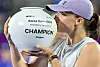 Iga Swiatek of Poland kisses the trophy after winning the women's singles title at the Korea Open at Olympic Park Tennis Center in Seoul on Sept. 21. [YONHAP]
