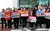 People Power Party party leader Jang Dong-hyuk and senior officials and lawmakers from the Chuncheon region hold signs with messages criticizing the Lee Jae Myung administration at a rally near Chuncheon City Hall in Gangwon on Nov. 30. [YONHAP]