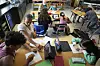 Art teacher Lindsay Johnson, second from left, teaches students how to ask ChatGPT for help during a summer class at Roosevelt Middle School on June 25, 2025, in River Forest, Illinois. [AP/YONHAP]