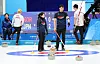 Korean curlers Kim Kyeong-ae, center left, and Seong Ji-hoon, center right, compete in the mixed doubles final against Koana Tori and Aoki Go of Japan at Harbin Pingfang District Curling Arena in Harbin, China on Feb. 8. [YONHAP]