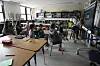 Art teacher Lindsay Johnson, right, teaches students how to ask ChatGPT for help during a summer class at Roosevelt Middle School on June 25 in River Forest, Illinois. [AP/YONHAP]
