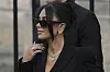 Kim Kardashian leaves the justice palace after testifying, regarding a robbery of millions of dollars in jewels from her Paris hotel room in 2016, in Paris, Tuesday, May 13. [AP/YONHAP]