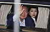 Former President Yoon Suk Yeol waves to supporters after leaving the presidential residence in Yongsan District, central, Seoul, on April 11, accompanied by his wife, Kim Keon Hee. [NEWS1]