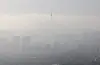 The downtown area of ??Seoul is seen as hazy from Inwang Mountain in Jongno District, central Seoul on March 13, wehn the concentration of fine dust nationwide was at a ″bad″ level due to the influence of yellow dust. [YONHAP]