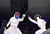 Kwon Hyo-kyeong, left, attacks Chen Yuandong of China in the women's epee final at the 2024 Paris Paralympic Games in Paris on Friday. [NEWS1]