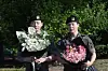 Members Jungkook, left, and Jimin of boy band BTS greet reporters with flower bouquets in their hands, after finishing their military duties on June 11 in Yeoncheon, Gyeonggi. [YONHAP]