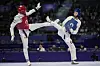 Korea's Kim Yu-jin, right, competes with Iran's Nahid Kiyanichandeh in the women's 57-kilogram taekwondo final at the Grand Palais in Paris on Thursday. [AP/YONHAP]