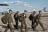 Russian servicemen leave a plane upon arrival to Chkalovsky airport, outside Moscow, Russia, after returning from captivity by a POWs exchange between Russia and Ukraine on May 25. [AP/YONHAP]