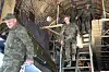 Russian servicemen leave a plane upon arrival to Chkalovsky airport, outside Moscow, Russia, after returning from captivity by a POWs exchange between Russia and Ukraine on May 25. [AP/YONHAP]
