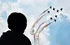 A person watches the Air Force's Black Eagles team's air show in Seongnam, Gyeonggi, on Oct. 19, 2025. [YONHAP]