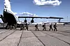 Russian servicemen leave a plane upon arrival to Chkalovsky airport, outside Moscow, Russia, after returning from captivity by a POWs exchange between Russia and Ukraine on May 25. [AP/YONHAP]
