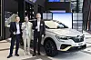 From left, Arnaud Belloni, vice president of Renault Group heading global marketing, Renault Korea CEO Stephane Deblaise, and Gilles Vidal, design director at Renault, take a photo with Arkana, previously known as XM3 in Korea, after a press conference Wednesday in eastern Seoul. [RENAULT KOREA]