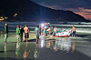 People drag the capsized boat to the shore of Koh Phangan, Thailand, on Sunday. [SCREEN CAPTURE]