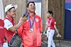 Hideki Matsuyama of Team Japan smiles with team coach Shigeki Maruyama after winning the bronze medal in the final round of the Olympic men's golf competition at the 2024 Paris Olympics on Aug. 4. [GETTY IMAGES]