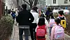 Several elementary school students head to their school in Seoul in March. [NEWS1]