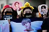 Fans wait for the arrival of K-pop band BTS members Jimin and Jungkook in Yeoncheon, Gyeonggi, on June 11, 2025. [AP/YONHAP]