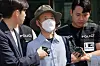Che Zhenan, a 56-year-old Chinese national who killed two people and injured two others in a series of violent attacks in Siheung, Gyeonggi, leaves the Siheung Police Station on May 21 to attend questioning. [NEWS1]