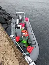 An unidentified rubber boat found on the shore near a haenyeo (women divers) changing station in Yongsu-ri, Hangyeong-myeon, Jeju on Sept. 8. [JOONGANG ILBO]