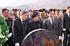 Defense Minister Ahn Gyu-back, front row right, and bereaved family members of those who died in the Yeonpyeong Island shelling pay their respects to the deceased at Daejeon National Cemetery on Nov. 23. [NEWS1]
