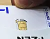 An employee at an SK Telecom retail store in Seoul demonstrates how to reset a SIM card on May 12. [YONHAP]