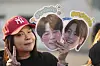 A fan from Thailand waits for the arrival of K-pop band BTS members Jimin and Jungkook in Yeoncheon, Gyeonggi, on June 11, 2025. [AP/YONHAP]