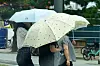 Tourists cross a sidewalk near a beach in Pohang on July 8. [NEWS1]