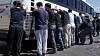 Detainees are made to stand against a bus before being handcuffed, during a raid by federal agents where about 300 South Koreans were among 475 people arrested at the site of a $4.3 billion project by Hyundai Motor and LG Energy Solution to build batteries for electric cars in Ellabell, Georgia on Sept. 4. [REUTERS/YONHAP]